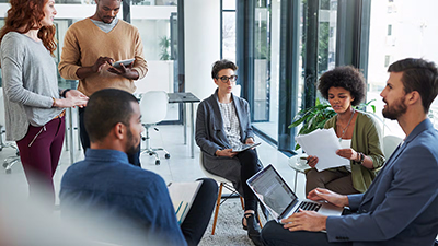 Image of diverse people meeting in an office